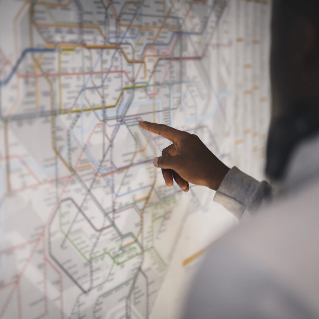 Couple checking a public transportation map