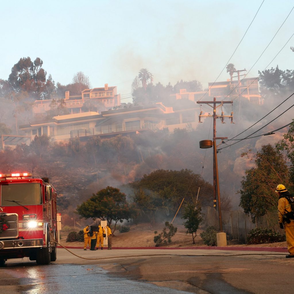 Firefighters,Are,Hard,At,Work,As,Smoke,Rises,From,The